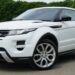 white land rover range rover suv on road